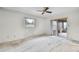Large bedroom featuring a ceiling fan and sliding glass doors to the sunroom at 715 Roughbeard Rd, Winter Park, FL 32792