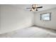 Bright bedroom features neutral walls, carpet flooring, and a ceiling fan at 715 Roughbeard Rd, Winter Park, FL 32792