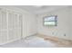 This bedroom features a closet and a sunlit window at 715 Roughbeard Rd, Winter Park, FL 32792