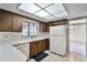 Functional kitchen featuring white appliances, ample counter space, and wood cabinetry at 715 Roughbeard Rd, Winter Park, FL 32792