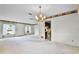 Spacious living room with carpet floors and a chandelier at 715 Roughbeard Rd, Winter Park, FL 32792