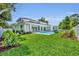 A large well-maintained lawn with an inviting pool and patio space perfect for outdoor gatherings at 731 Williams Dr, Winter Park, FL 32789