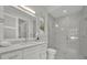 Modern bathroom featuring a glass shower, white cabinets, and a large sink with a window view at 731 Williams Dr, Winter Park, FL 32789