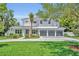 Beautiful two-story home featuring a three-car garage and manicured landscaping at 731 Williams Dr, Winter Park, FL 32789