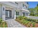 Inviting front entrance with modern door, stone walkway, and lush landscaping at 731 Williams Dr, Winter Park, FL 32789