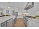 Beautiful kitchen with a large island, white subway tiles, stainless steel appliances and luxurious countertops at 731 Williams Dr, Winter Park, FL 32789