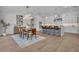 Open kitchen and dining area featuring modern appliances, countertops, and stylish light fixtures at 731 Williams Dr, Winter Park, FL 32789