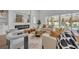 Cozy living room showcasing a fireplace, modern decor, and sliding doors to the outdoor pool area at 731 Williams Dr, Winter Park, FL 32789