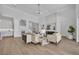 Open living room with hardwood floors, fireplace, and ample seating at 731 Williams Dr, Winter Park, FL 32789