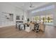 Elegant living room featuring a fireplace, built-in shelving, and sliding glass doors to the backyard at 731 Williams Dr, Winter Park, FL 32789