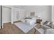 Comfortable main bedroom with hardwood floors, neutral paint, and ensuite bath at 731 Williams Dr, Winter Park, FL 32789