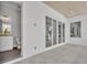 Bathroom with a modern sink, toilet, and tile flooring adjoining an expansive outdoor living space at 731 Williams Dr, Winter Park, FL 32789