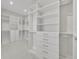 Spacious walk-in closet with custom shelving and drawer systems for optimal storage at 731 Williams Dr, Winter Park, FL 32789