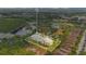 Aerial view of the community's layout, showcasing the buildings' positioning, surrounding nature, and property lines at 8908 Legacy Ct # 303, Kissimmee, FL 34747