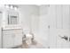Bathroom with white cabinets, granite countertop, framed mirror, and a shower-tub combo at 8908 Legacy Ct # 303, Kissimmee, FL 34747
