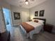 Cozy bedroom featuring a plush rug, queen bed, and stylish decor at 8908 Legacy Ct # 303, Kissimmee, FL 34747