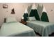 Whimsical bedroom with twin beds and mountain-themed decor at 8908 Legacy Ct # 303, Kissimmee, FL 34747
