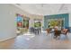 Open floor plan community room with dining tables and natural lighting at 8908 Legacy Ct # 303, Kissimmee, FL 34747