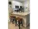 A kitchen featuring stainless steel appliances, a granite countertop, and wooden bar stools at 8908 Legacy Ct # 303, Kissimmee, FL 34747