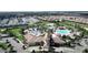 Beautiful aerial view of community clubhouse, pools, and manicured landscaping in a desirable neighborhood at 8993 Cabot Cliffs Dr, Davenport, FL 33896