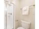 This bright bathroom features a walk-in shower and a standard toilet at 8993 Cabot Cliffs Dr, Davenport, FL 33896