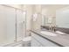 Modern bathroom with a glass-enclosed shower, sleek vanity, and neutral color palette at 8993 Cabot Cliffs Dr, Davenport, FL 33896