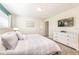 Inviting bedroom with a queen bed, soft lighting, and a clean, contemporary style at 8993 Cabot Cliffs Dr, Davenport, FL 33896