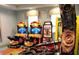 Community game room with retro arcade games, pinball, and candy vending at 8993 Cabot Cliffs Dr, Davenport, FL 33896