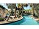 This lush community features a lazy river, tropical plants and wood bridges at 8993 Cabot Cliffs Dr, Davenport, FL 33896