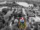Aerial view of the property with a lake, showcasing its location within a residential area at 913 Bending Oak Trl, Winter Garden, FL 34787