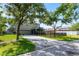 Back exterior of home with screened lanai, garage, and fenced yard at 913 Bending Oak Trl, Winter Garden, FL 34787