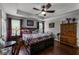 Spacious primary bedroom featuring hardwood floors, ceiling fan, and plenty of natural light at 913 Bending Oak Trl, Winter Garden, FL 34787