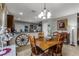 A dining area featuring a wooden table and a view of the kitchen, complete with unique decor at 913 Bending Oak Trl, Winter Garden, FL 34787