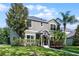 Beautiful home exterior featuring lush landscaping and a well-maintained lawn at 913 Bending Oak Trl, Winter Garden, FL 34787