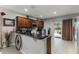 A modern kitchen featuring granite countertops, stainless steel appliances, and a breakfast bar at 913 Bending Oak Trl, Winter Garden, FL 34787