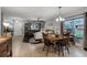 A spacious living room that combines dining and relaxation areas with plenty of natural light at 913 Bending Oak Trl, Winter Garden, FL 34787