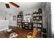 Upper level loft space featuring bookshelves, ceiling fan, and access to bedrooms at 913 Bending Oak Trl, Winter Garden, FL 34787