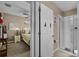 A serene main bedroom with soft lighting, a comfortable bed, and a glimpse into the en-suite bathroom at 913 Bending Oak Trl, Winter Garden, FL 34787