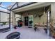 Covered patio with BBQ and seating area, perfect for outdoor gatherings and relaxation at 913 Bending Oak Trl, Winter Garden, FL 34787