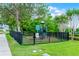 Fenced playground with play set on grassy lawn at 913 Bending Oak Trl, Winter Garden, FL 34787