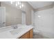 Bathroom features a large countertop, a single sink, and a combined shower and tub with white tile at 9545 Southern Garden Cir, Altamonte Springs, FL 32714