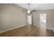 Spacious bedroom featuring hardwood floors, ceiling fan, and an ensuite bathroom at 9545 Southern Garden Cir, Altamonte Springs, FL 32714