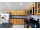 Bright kitchen with stainless steel appliances, granite countertops, and wooden cabinets at 9545 Southern Garden Cir, Altamonte Springs, FL 32714