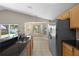 Modern kitchen with granite countertops, stainless steel appliances, and tile flooring at 9545 Southern Garden Cir, Altamonte Springs, FL 32714