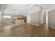 Open-concept living space with hardwood floors, and kitchen featuring stainless steel appliances and a breakfast bar at 9545 Southern Garden Cir, Altamonte Springs, FL 32714