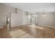 Spacious open living room showcasing light wood floors, neutral walls, and an inviting entryway at 9545 Southern Garden Cir, Altamonte Springs, FL 32714