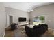 Bright living room features vaulted ceilings, wood floors, and sliding glass doors leading to the backyard at 9545 Southern Garden Cir, Altamonte Springs, FL 32714