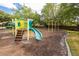Community playground with colorful play structures, slides, and a swing set for children at 9545 Southern Garden Cir, Altamonte Springs, FL 32714