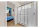 Bathroom showcasing glass enclosed shower, with adjacent themed bedroom at 1031 Marcello Blvd, Kissimmee, FL 34746