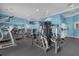 Spacious gym with several workout machines, black rubber floor, and televisions at 1031 Marcello Blvd, Kissimmee, FL 34746